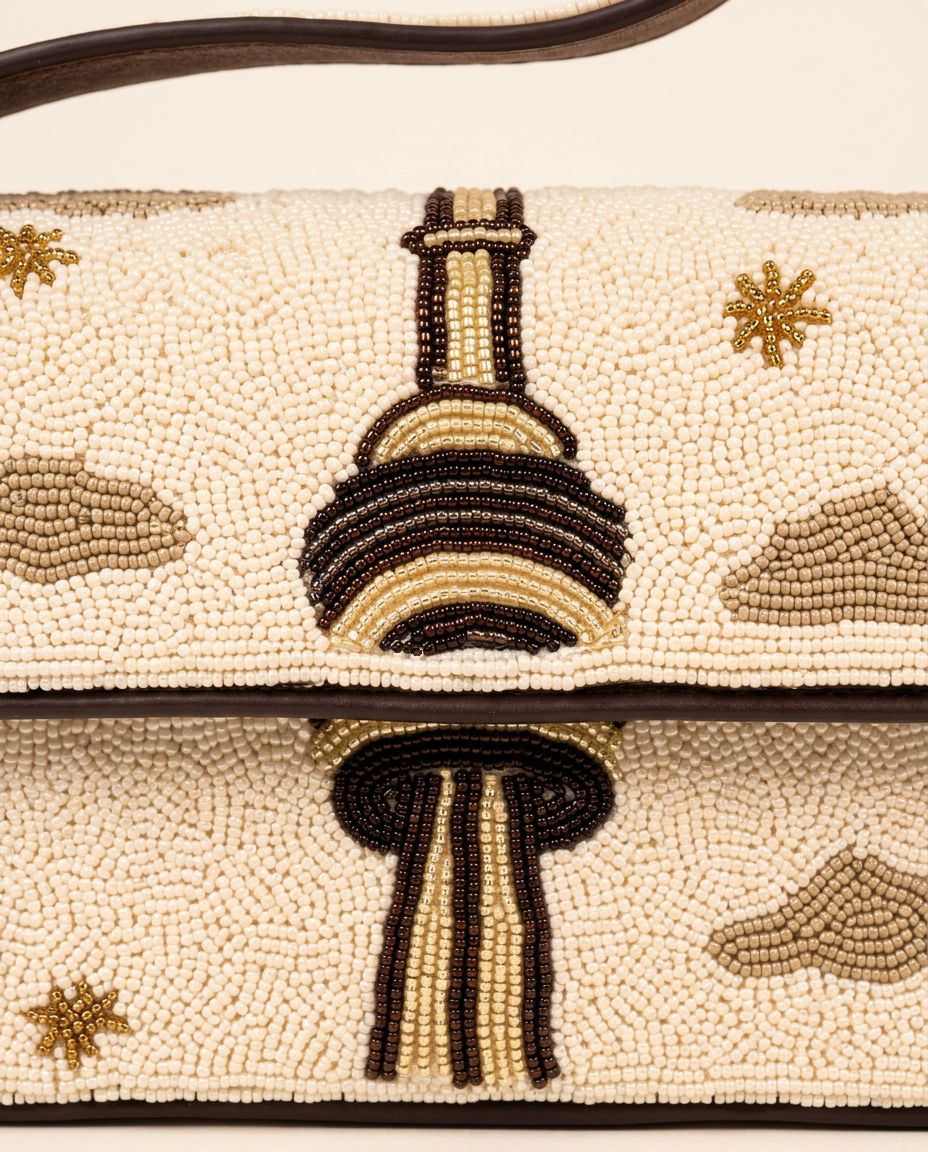 The Toronno beadwork detail, showing its cream and dark brown skyline tower motif
